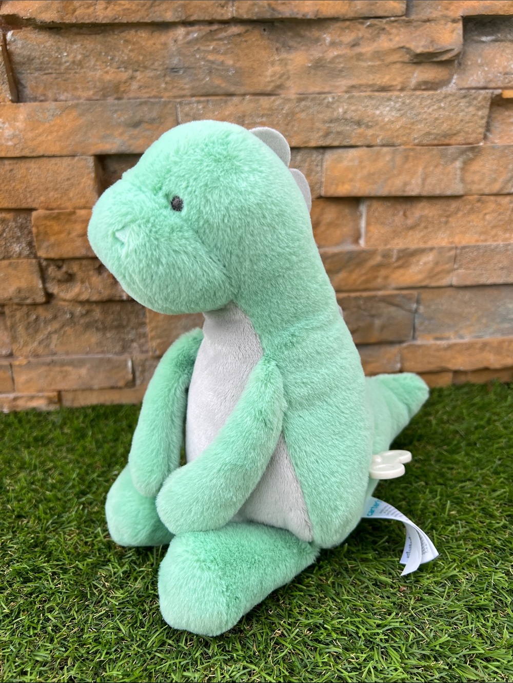Carter's Waggy Musical Dino plush toy that plays "Twinkle, Twinkle, Little Star"